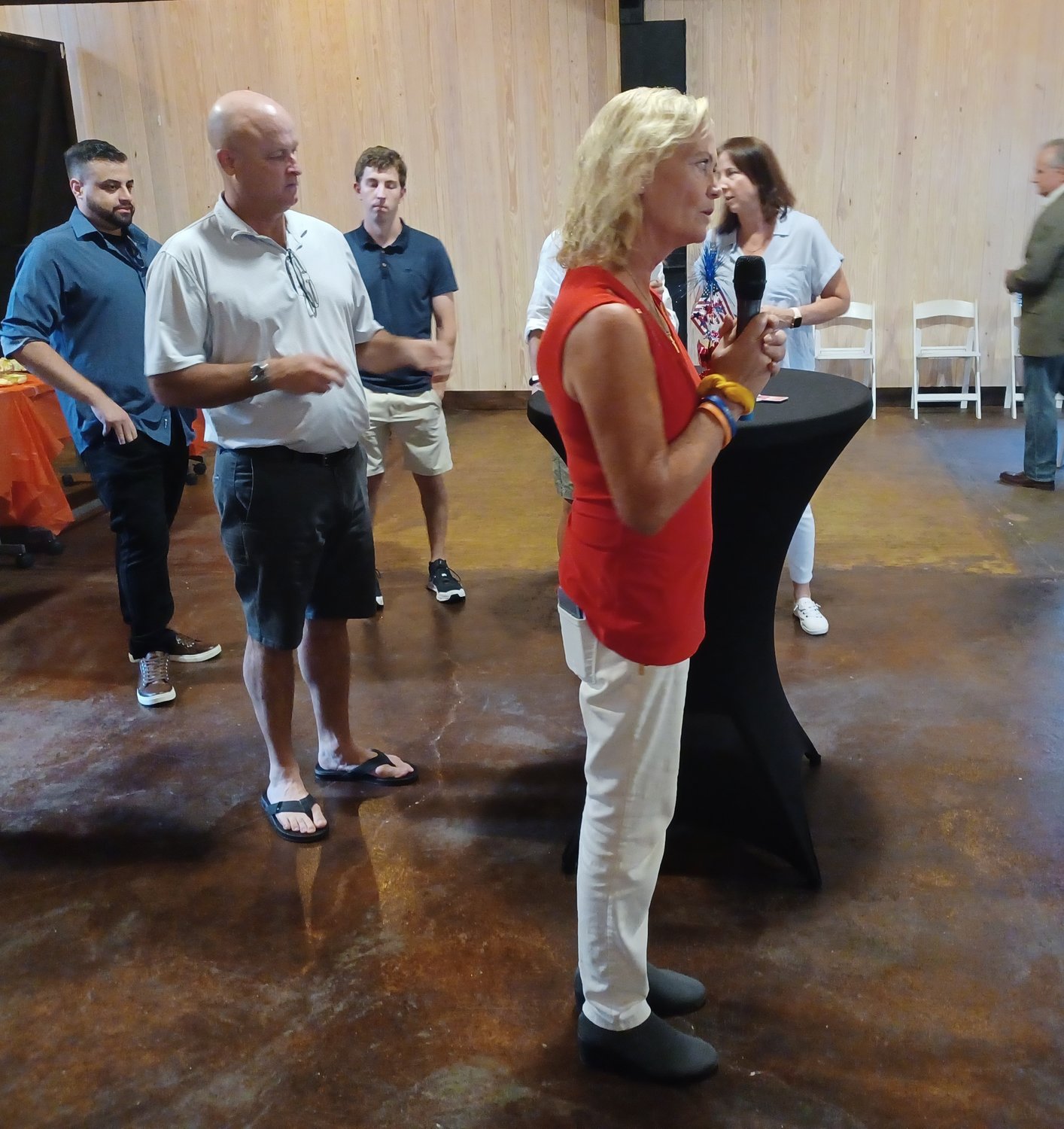 Deb Chapin, owner and event planner at the Palm Valley Barn, speaks to attendees.